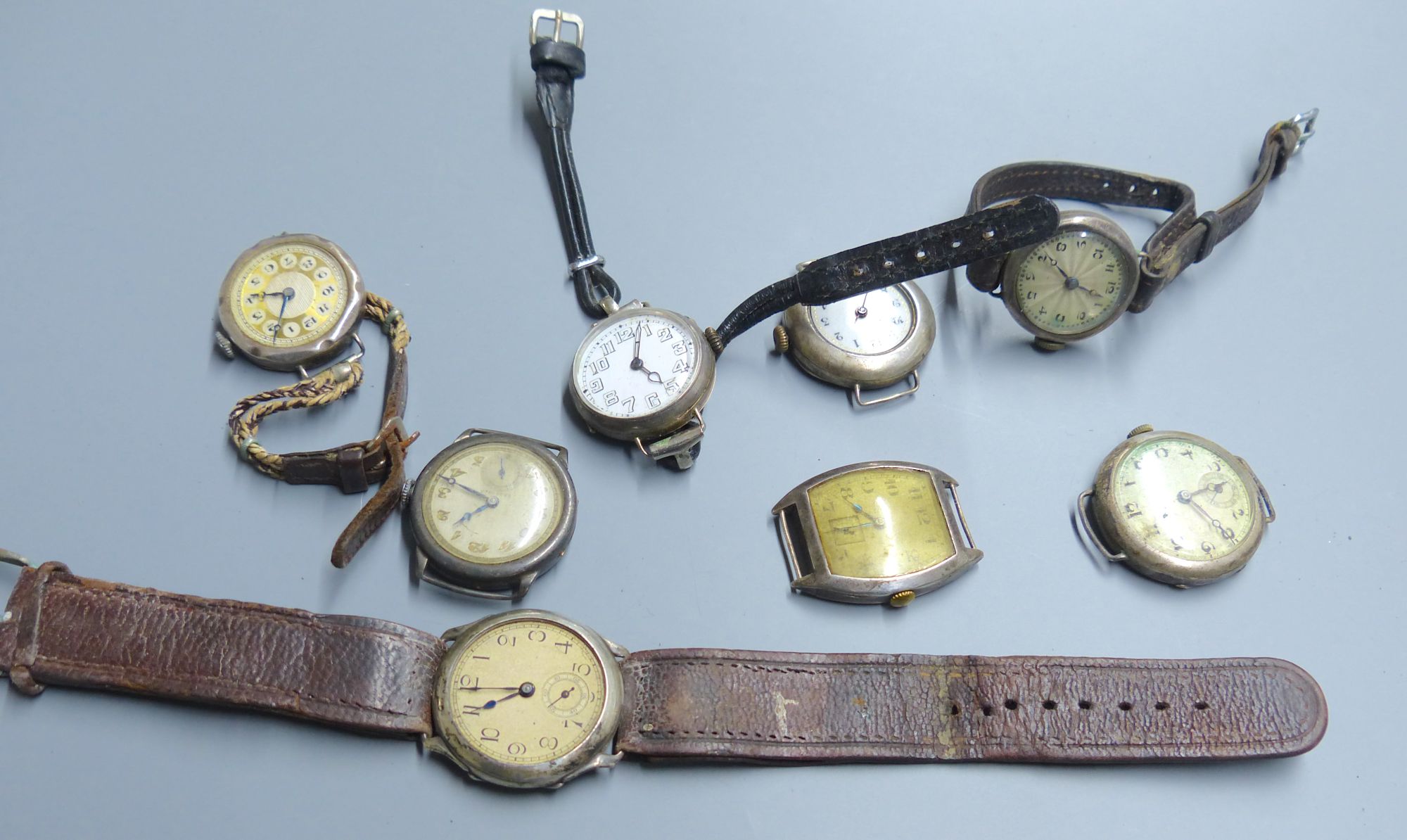 Eight assorted early to mid 20th century silver and white metal wrist watches (a.f.).